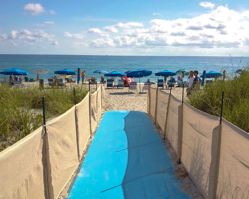 Load image into Gallery viewer, Weather barriers next to entrance to the beach