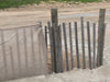 Fence post on the beach