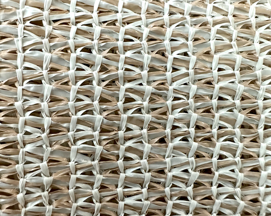 Close up of tan evoguard weather barrier product that looks like mesh